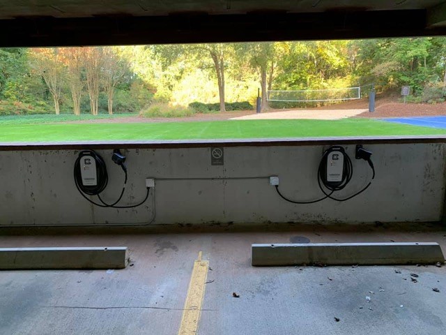 Electric car charging stations in a public parking garage.