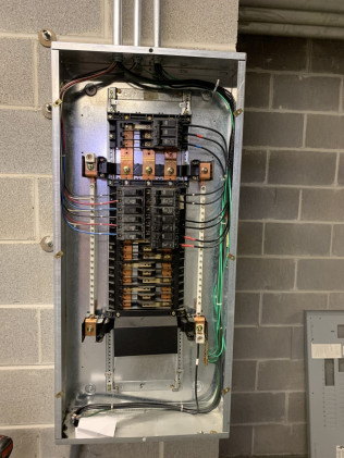 Commercial electrical work in a parking garage.