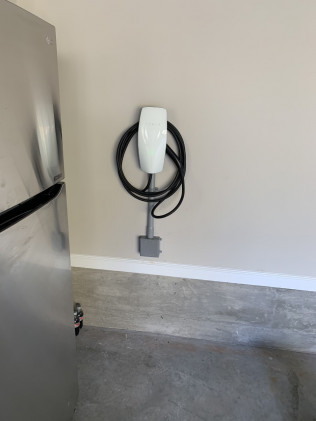 A garage charging station for an electric car.