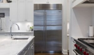 A refrigerator in a high-end residential kitchen.